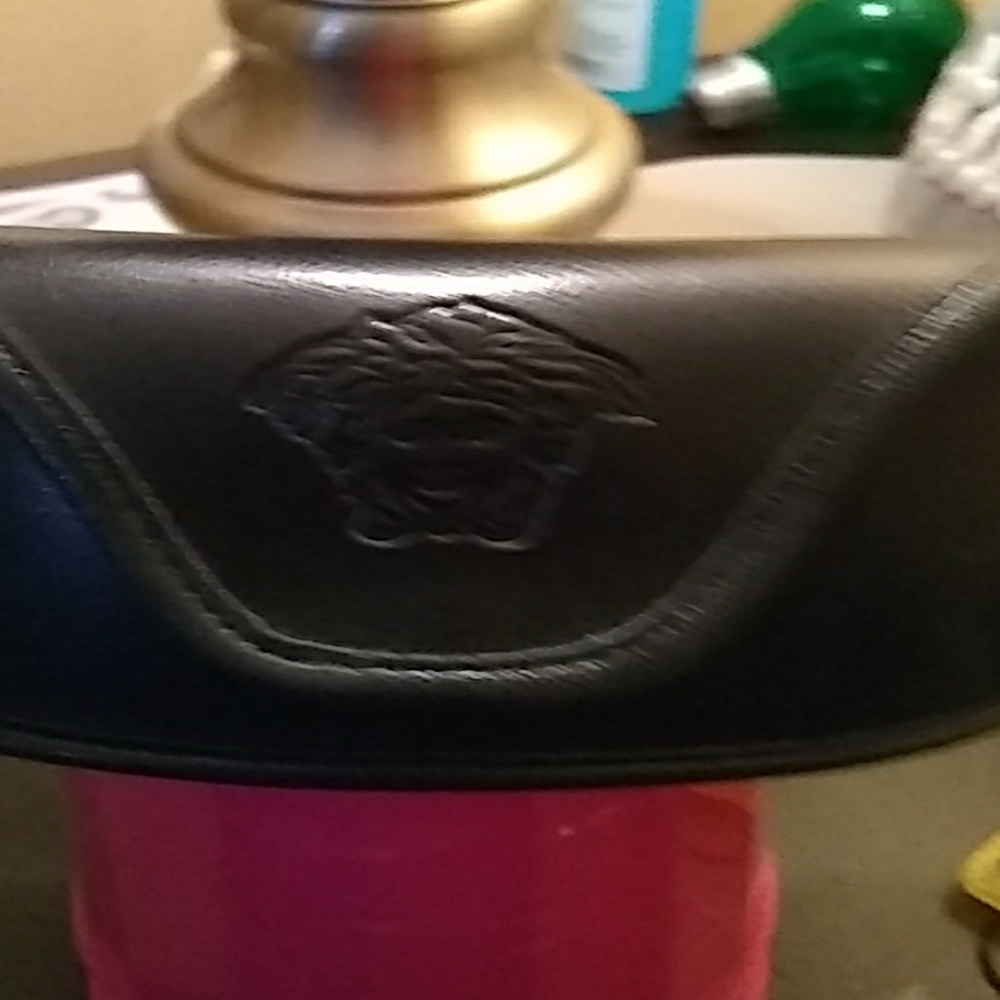 Versace

 Glasses Black and gold with the case